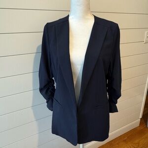 Skies Are Blue navy blazer. Pink floral liner. 3/4 length sleeves.